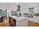 Modern kitchen island with stove top in a spacious open floor plan at 21 Collins Dr, Douglasville, GA 30134
