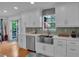 Updated kitchen featuring stainless steel appliances, white cabinetry, and backsplash at 21 Collins Dr, Douglasville, GA 30134