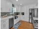 Modern kitchen with white cabinets, stainless steel appliances, and lots of counter space at 21 Collins Dr, Douglasville, GA 30134