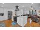 Open concept layout with kitchen island and living area with fireplace at 21 Collins Dr, Douglasville, GA 30134