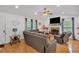 Comfortable living room with hardwood floors, large sofa, and a fireplace at 21 Collins Dr, Douglasville, GA 30134