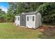 Well-maintained storage shed with neutral siding and contrasting trim, providing practical outdoor storage space at 21 Collins Dr, Douglasville, GA 30134