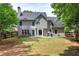 Large backyard featuring a patio with outdoor seating, perfect for relaxing or entertaining at 3186 Sail Winds Nw Dr, Acworth, GA 30101