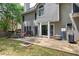 Backyard patio features ample seating, a grill, and views of the mature landscaping at 3186 Sail Winds Nw Dr, Acworth, GA 30101