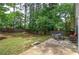 Spacious backyard with a mix of sun and shade, a patio, and a wood fence at 3186 Sail Winds Nw Dr, Acworth, GA 30101