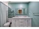 Stylish bathroom with a double vanity, a toilet and modern fixtures at 3186 Sail Winds Nw Dr, Acworth, GA 30101