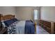 Cozy bedroom featuring a wood bed frame, and neutral decor at 3186 Sail Winds Nw Dr, Acworth, GA 30101