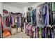 Walk-in closet with ample hanging space, shelving, and organization for clothes and accessories at 3186 Sail Winds Nw Dr, Acworth, GA 30101