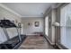 Spacious exercise room with treadmill, weight bench and natural light at 3186 Sail Winds Nw Dr, Acworth, GA 30101