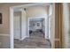 Inviting foyer with wood-look floors, showcasing access to a workout area and a glimpse of the front door at 3186 Sail Winds Nw Dr, Acworth, GA 30101
