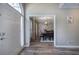 Welcoming foyer leading to the dining room with vinyl floors and neutral color palette at 3186 Sail Winds Nw Dr, Acworth, GA 30101