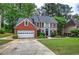 Charming two-story brick home with a manicured lawn and attached two-car garage at 3186 Sail Winds Nw Dr, Acworth, GA 30101