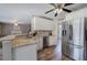 Bright kitchen with stainless steel appliances, granite countertops, and wood-look flooring at 3186 Sail Winds Nw Dr, Acworth, GA 30101