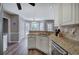 Spacious kitchen with granite countertops, stainless steel dishwasher, and breakfast nook at 3186 Sail Winds Nw Dr, Acworth, GA 30101