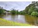 Scenic lake view showcasing waterfront homes and lush trees, enhancing the tranquil community ambiance at 3186 Sail Winds Nw Dr, Acworth, GA 30101