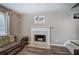 Living room featuring a decorative fireplace, neutral paint, and staircase at 3186 Sail Winds Nw Dr, Acworth, GA 30101