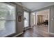 Living room with hardwood floors, neutral colors, natural light, and entry view to dining area at 3186 Sail Winds Nw Dr, Acworth, GA 30101