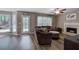 Cozy living room featuring modern vinyl floors, fireplace, and plenty of natural light at 3186 Sail Winds Nw Dr, Acworth, GA 30101