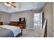 Spacious main bedroom boasts neutral walls, trey ceiling, ceiling fan, and warm toned furniture at 3186 Sail Winds Nw Dr, Acworth, GA 30101