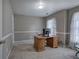 Home office setup with desk and a window allowing natural light at 3186 Sail Winds Nw Dr, Acworth, GA 30101