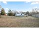 Large backyard featuring an old barn and plenty of open space, enclosed with a fence at 4605 Doss Cir, Powder Springs, GA 30127