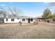 Spacious backyard with a view of the home's covered patio and well-maintained lawn at 4605 Doss Cir, Powder Springs, GA 30127