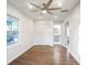 Well-lit bedroom boasts hardwood floors, a large closet, and an open doorway to the bathroom at 4605 Doss Cir, Powder Springs, GA 30127