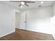 Bedroom featuring dark wood floors, white walls, and a ceiling fan at 4605 Doss Cir, Powder Springs, GA 30127
