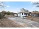 Charming home with covered parking, driveway and a welcoming front porch at 4605 Doss Cir, Powder Springs, GA 30127
