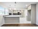 Modern kitchen featuring stainless steel appliances, white cabinetry, and a breakfast bar at 4605 Doss Cir, Powder Springs, GA 30127