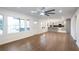 Open-concept layout connecting the living room to the kitchen, with hardwood floors at 4605 Doss Cir, Powder Springs, GA 30127