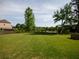 Spacious, green backyard with trees and a view of the surrounding greenery at 4790 Epps Ln, Cumming, GA 30040