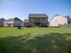 Spacious backyard with green lawn and patio area, perfect for outdoor activities at 4790 Epps Ln, Cumming, GA 30040