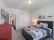 Bedroom featuring a large window, wooden bedframe, and view to the living area at 4790 Epps Ln, Cumming, GA 30040