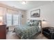 Cozy bedroom featuring a comfortable bed, side tables, and window providing natural light at 4790 Epps Ln, Cumming, GA 30040