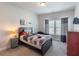 Bright bedroom with a window, wooden bed frame, and modern accents at 4790 Epps Ln, Cumming, GA 30040