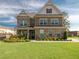 Charming two-story brick home with a well-manicured lawn and inviting curb appeal at 4790 Epps Ln, Cumming, GA 30040