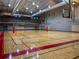 Well-lit gymnasium with hardwood floors and basketball hoops, promoting an active and healthy lifestyle for residents at 4790 Epps Ln, Cumming, GA 30040