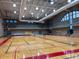 Bright and spacious gymnasium with polished hardwood floors and ample lighting, ideal for sports and recreational activities at 4790 Epps Ln, Cumming, GA 30040
