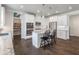 Open-concept kitchen with white cabinets, stainless appliances, and a walk-in pantry at 4790 Epps Ln, Cumming, GA 30040