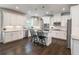 Stylish kitchen with white cabinets, granite countertops, and stainless steel appliances at 4790 Epps Ln, Cumming, GA 30040