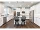 Modern kitchen with white cabinets, stainless steel appliances, and a granite island at 4790 Epps Ln, Cumming, GA 30040