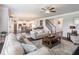 Spacious living room with hardwood floors, a ceiling fan, and an open floor plan at 4790 Epps Ln, Cumming, GA 30040