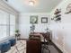 An organized home office offers natural light and a comfortable workspace with modern decor at 4790 Epps Ln, Cumming, GA 30040