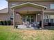 Outdoor patio with seating area and overhead covering, providing a space for relaxing at 4790 Epps Ln, Cumming, GA 30040