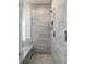 New bathroom shower with a tiled shower stall and seamless glass doors at 4790 Epps Ln, Cumming, GA 30040