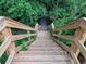 Wooden staircase leading down a hill surrounded by lush vegetation at 4790 Epps Ln, Cumming, GA 30040
