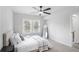 Bright bedroom featuring ample natural light, neutral color scheme, and ceiling fan at 1673 Richland Sw Rd, Atlanta, GA 30311