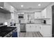 Modern kitchen with stainless steel appliances, sleek cabinets, and stylish finishes at 1673 Richland Sw Rd, Atlanta, GA 30311