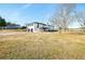 Back of house features a deck and two-car garage, all on a large lot at 3241 Broadnax Mill Rd, Loganville, GA 30052